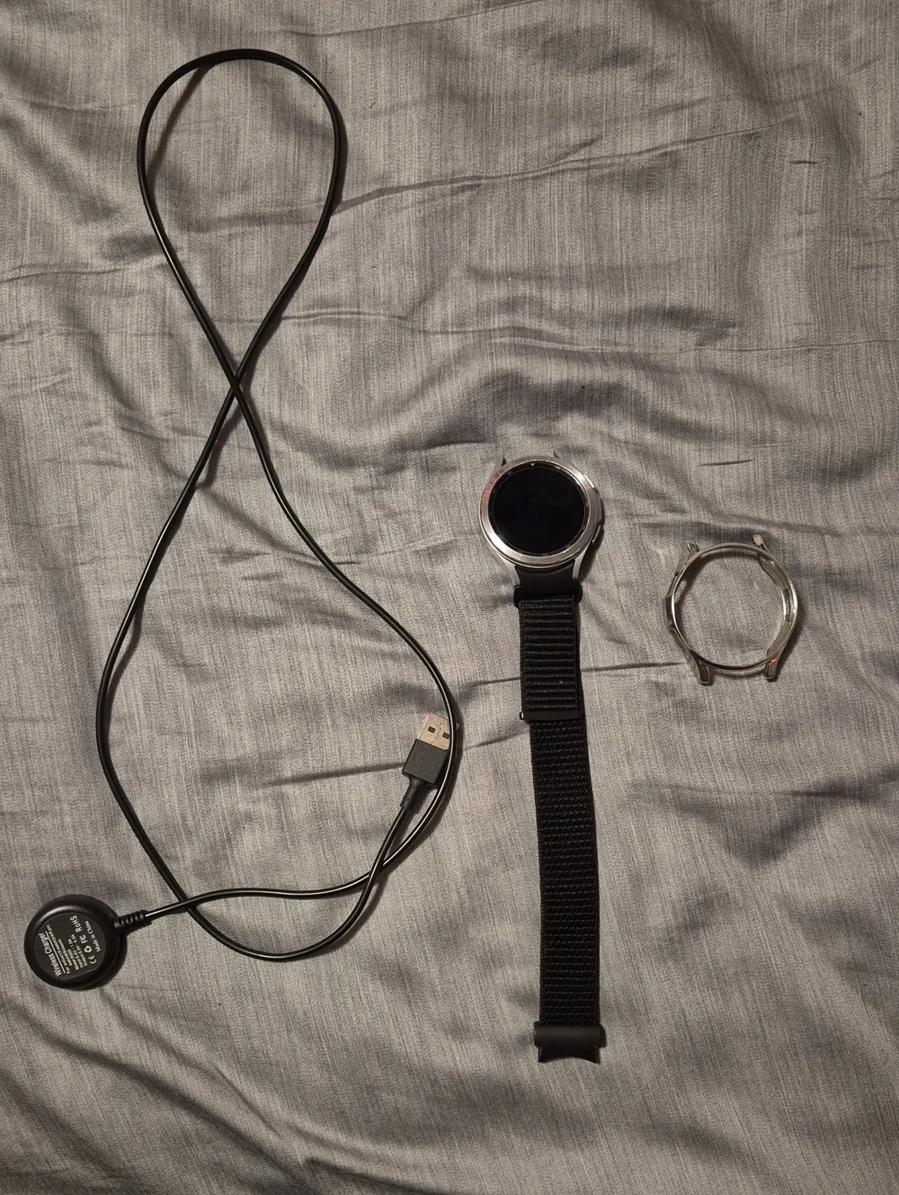 Samsung GALAXY Watch 4 Classic With Silver Shell, Velcro Wristband, and Charger